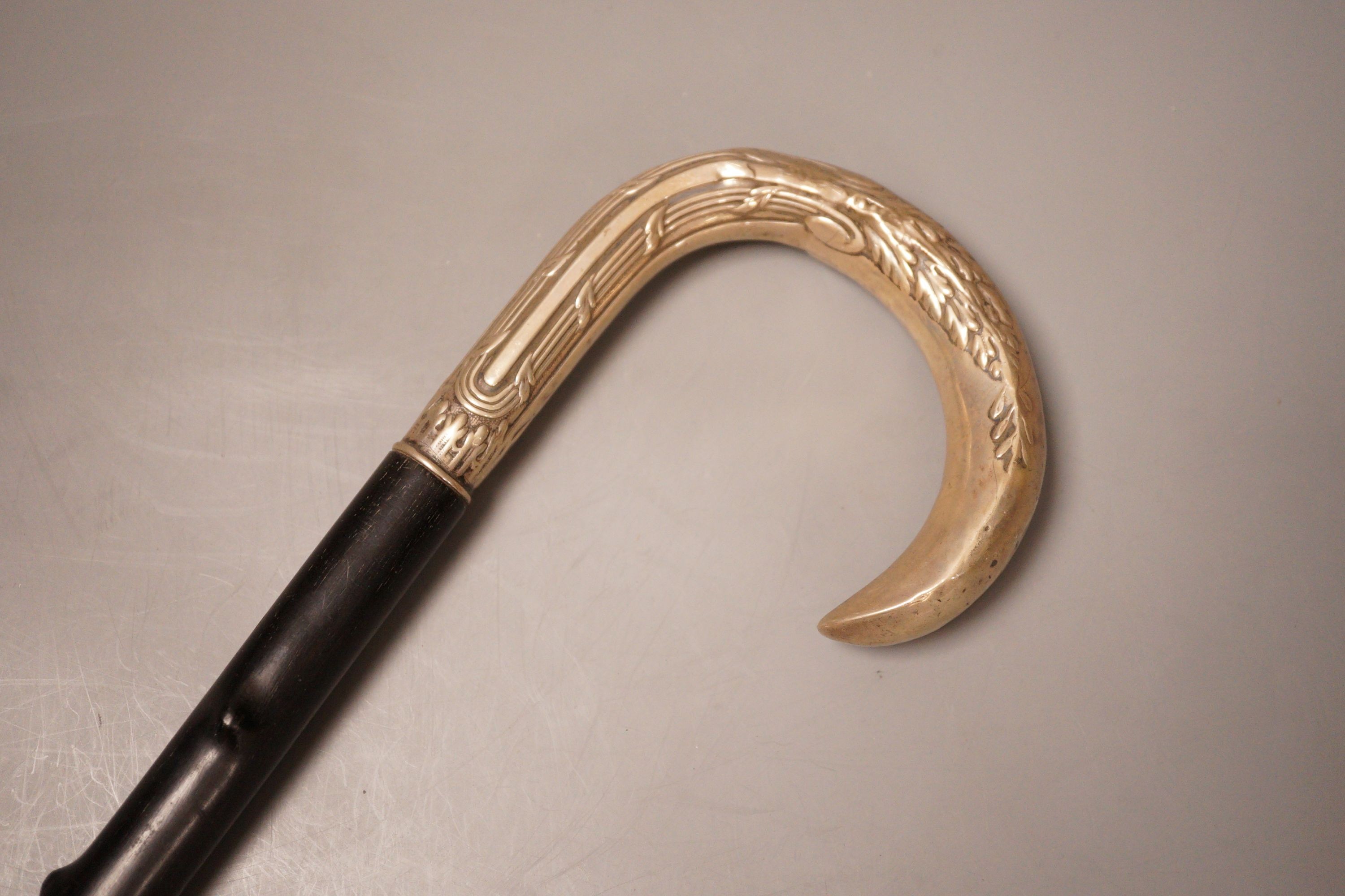 An 800 stamped white metal handled walking stick, 93cm long